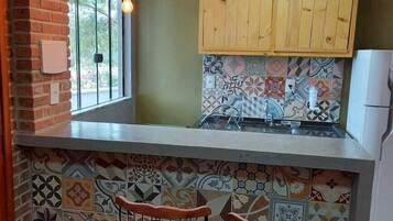 Fridge, oven, cookware/dishes/utensils, cleaning supplies