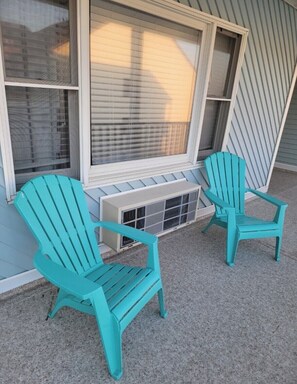 Relax in Adirondack chairs by the window, taking in the view.