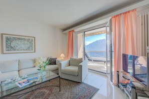 Family Apartment, Multiple Bedrooms, 2 Bathrooms, Mountainside (Casa monti belvedere) | Living area | Flat-screen TV