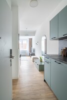 Suite with sofa bed | Private kitchen | Fridge, microwave, stovetop, dishwasher