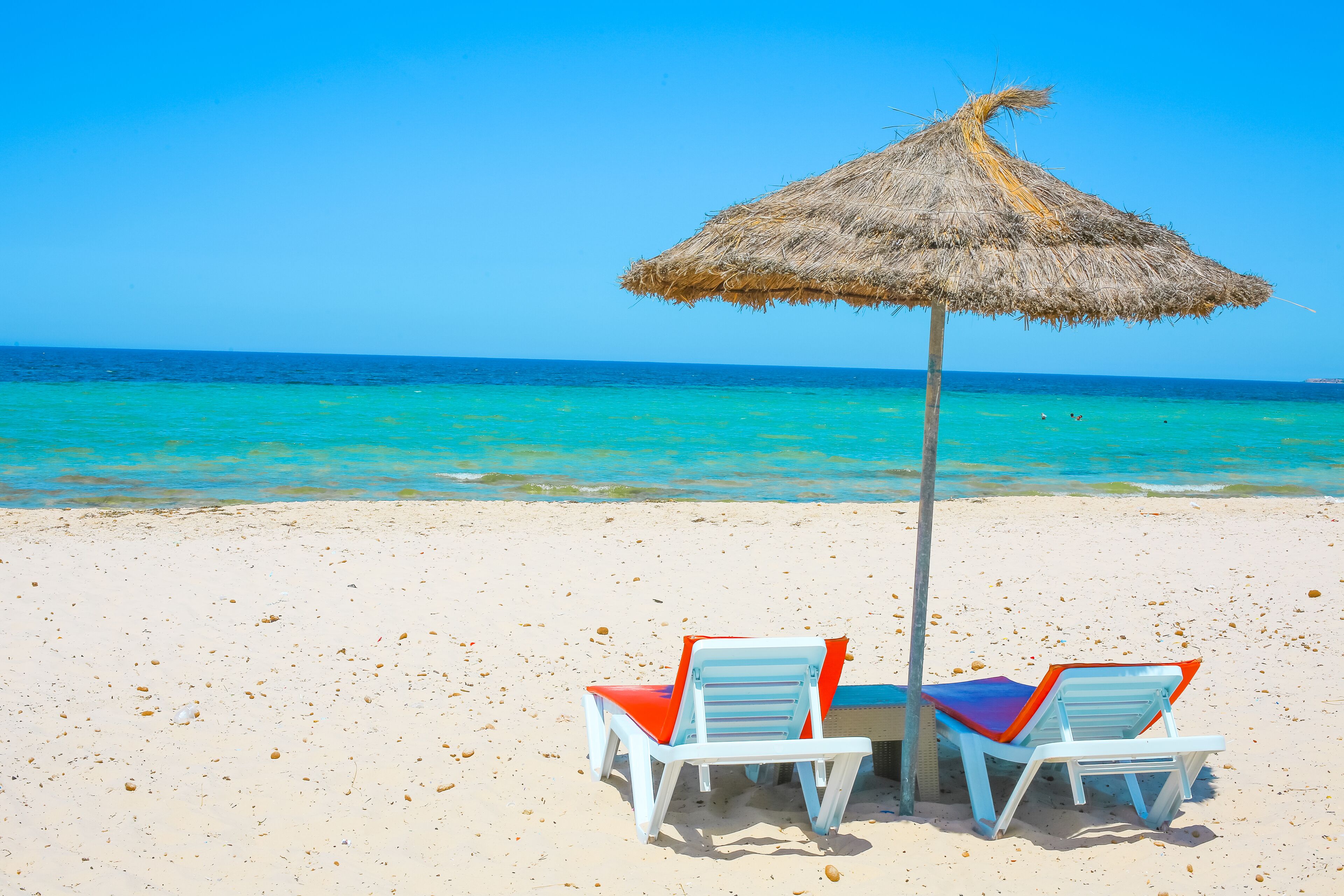 private beach, white sand, beach umbrellas, beach bar