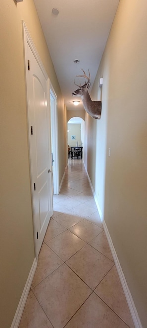 Leading to a dining area with a table and chairs.