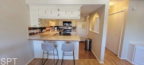 Apartment, Multiple Beds, Patio, Garden View | Private kitchen | Fridge, microwave, oven, stovetop