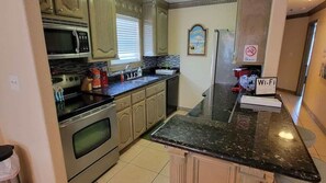 Condo, Multiple Beds, Patio, Pool View | Private kitchen | Fridge, microwave, oven, stovetop