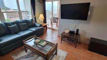 Condo, Multiple Beds, Balcony, Partial Sea View | Living area | TV