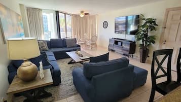 Apartment, Multiple Beds, Balcony, Pool View | Living area | TV