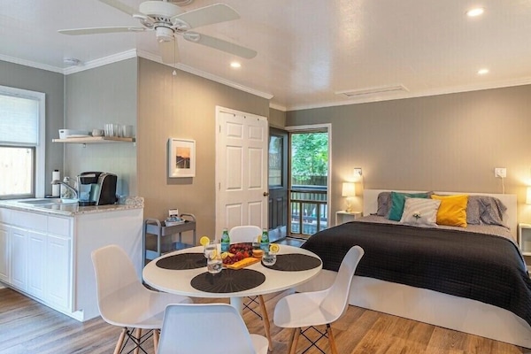 Open, bright, & airy atmosphere leading to a private fenced yard.