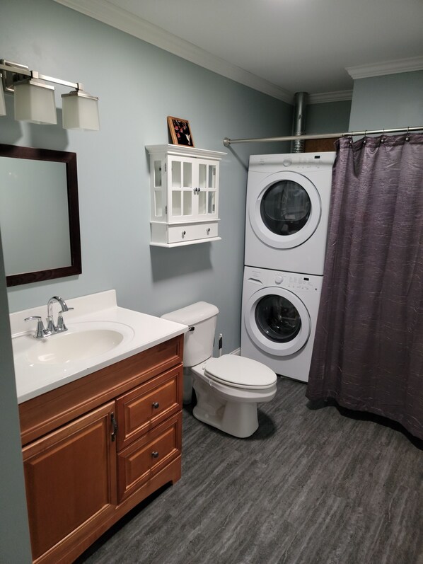 Shower, towels, soap, toilet paper