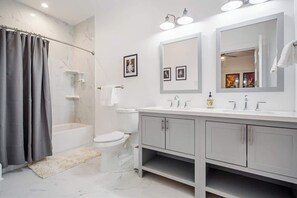 Shower, hair dryer, towels, shampoo