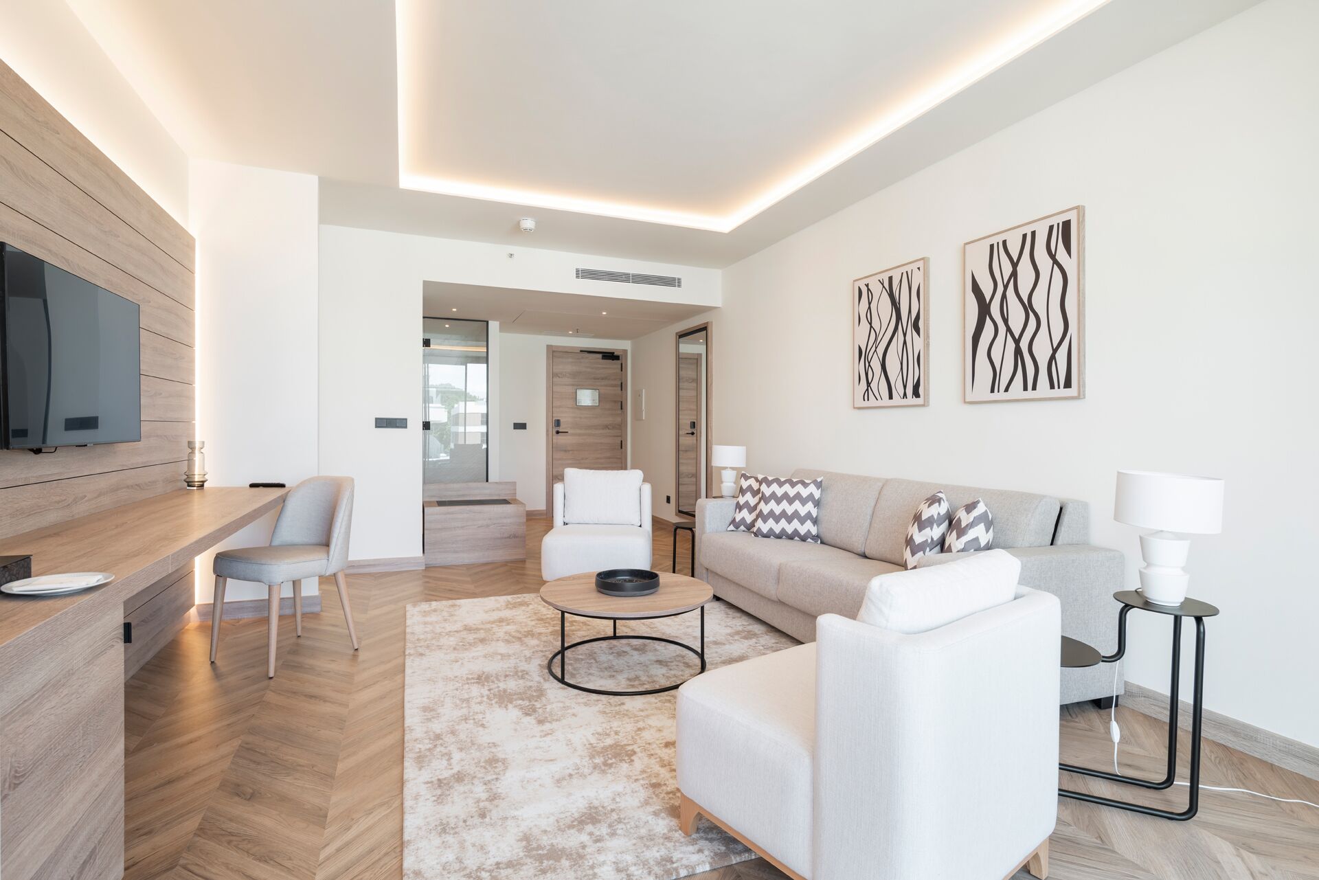 grand studio suite | living area | flat-screen tv