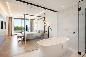 Deluxe Suite, Sea View | Bathroom | Shower, hair dryer, bathrobes, slippers