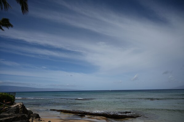 A beach with clear skies and calm waters.
