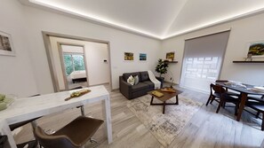 Business Suite, 1 Queen Bed with Sofa bed, Non Smoking | Living area | Smart TV