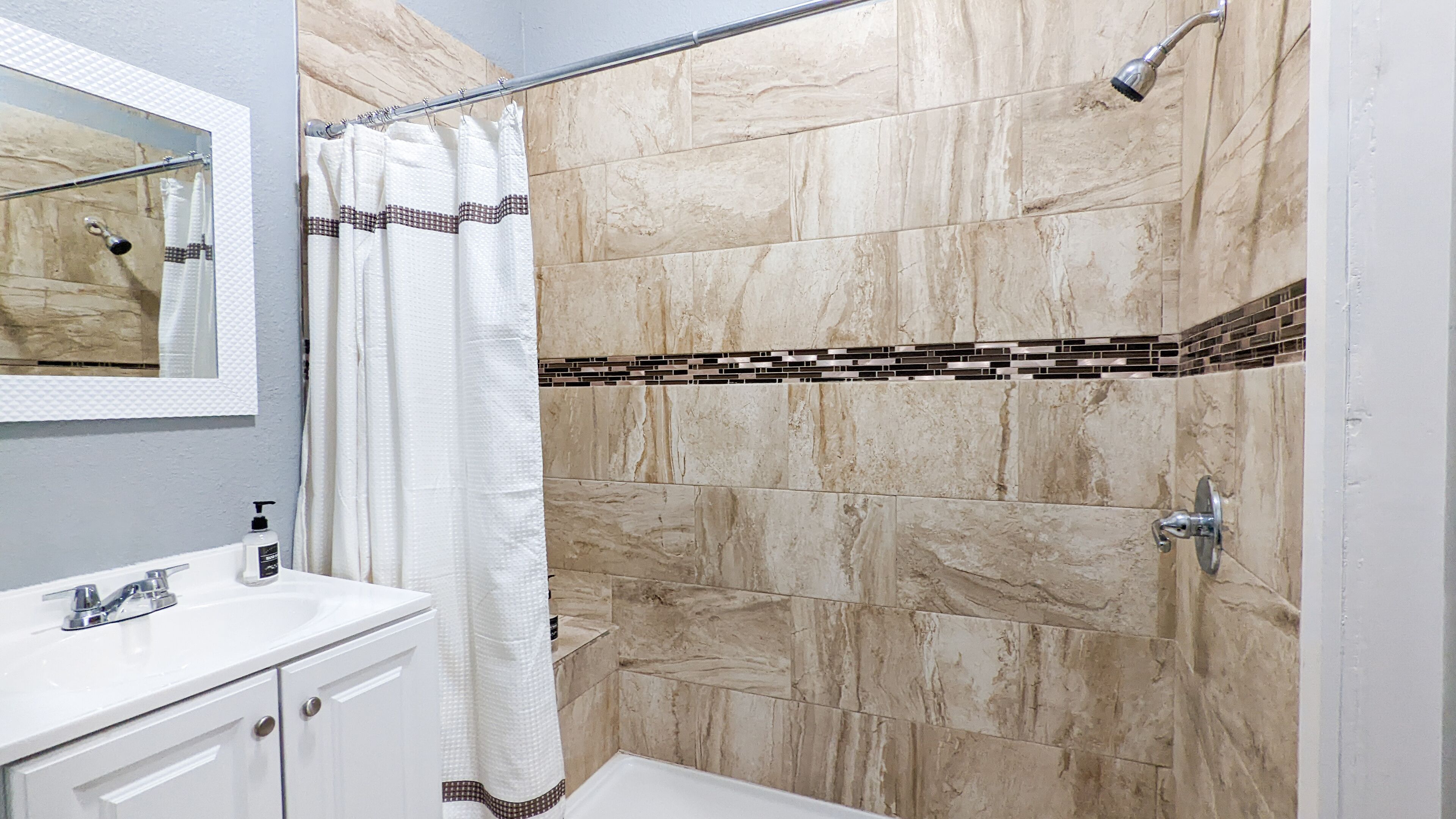 Shower, hair dryer, towels, shampoo