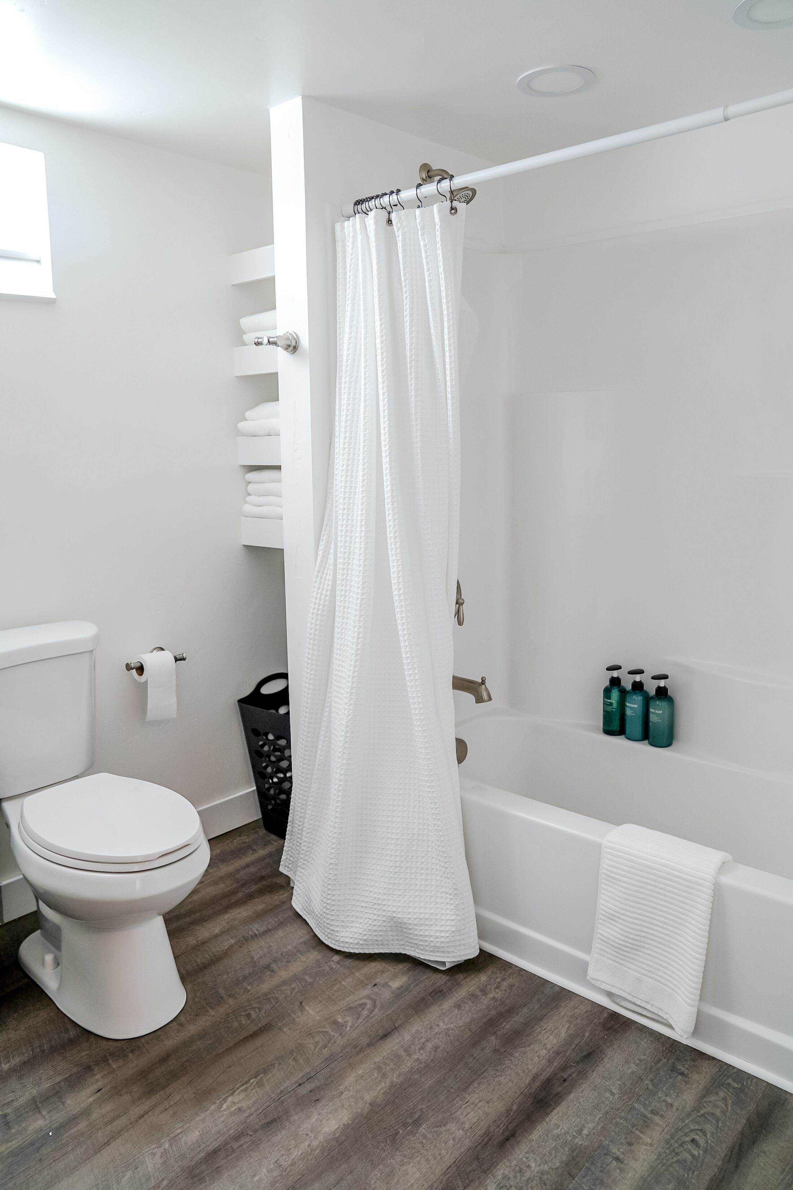 Bathtub, hair dryer, towels, soap