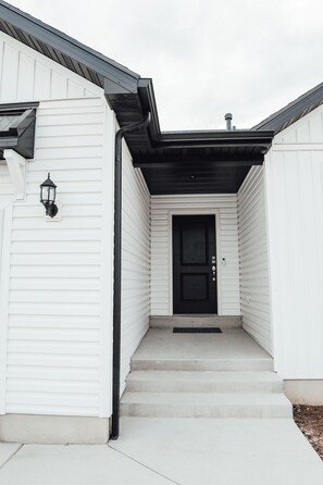 Stylish residential building with a symmetrical facade and modern design.