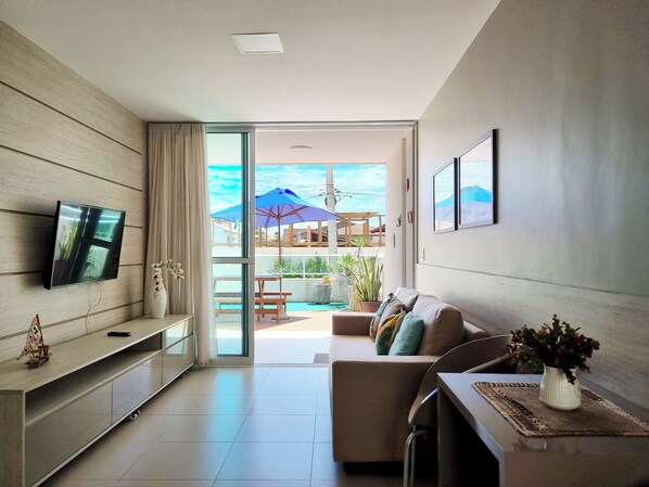 Apartment | Living area | 40-inch LED TV with digital channels, TV - Areias do Mar | 2 Quartos Garden Familia A113 (Barra de São Miguel)