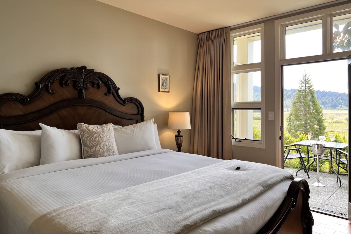 King Room with walk-in shower & patio (#102) | Individually decorated, individually furnished, blackout drapes