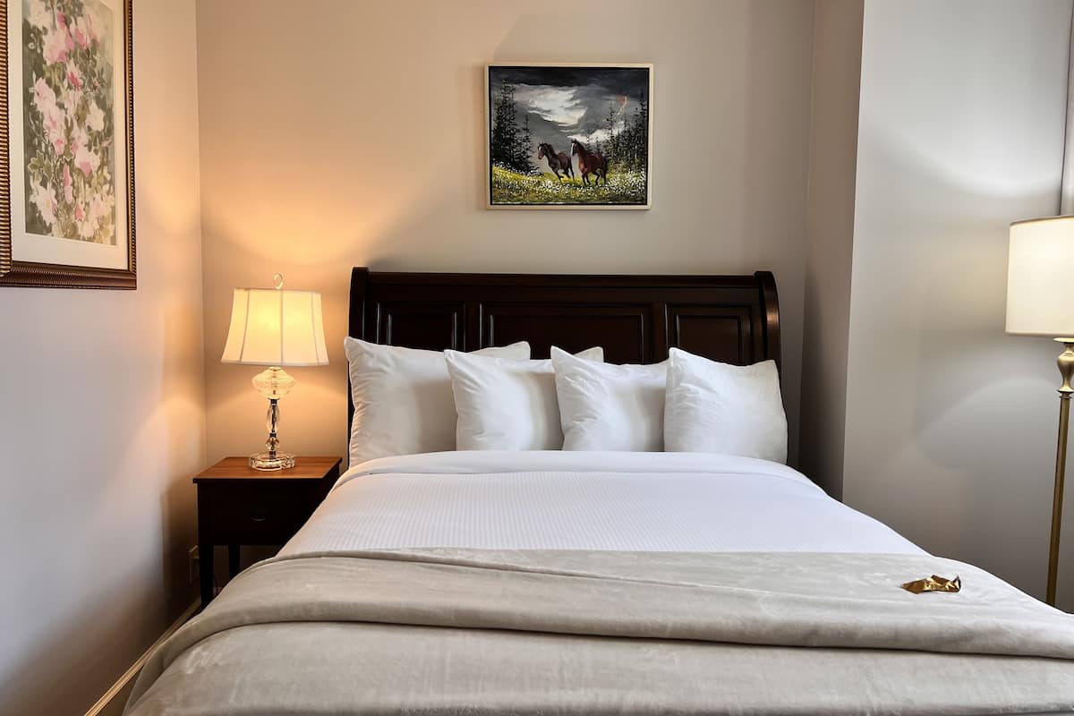 Traditional Queen Room upstairs | Individually decorated, individually furnished, blackout drapes