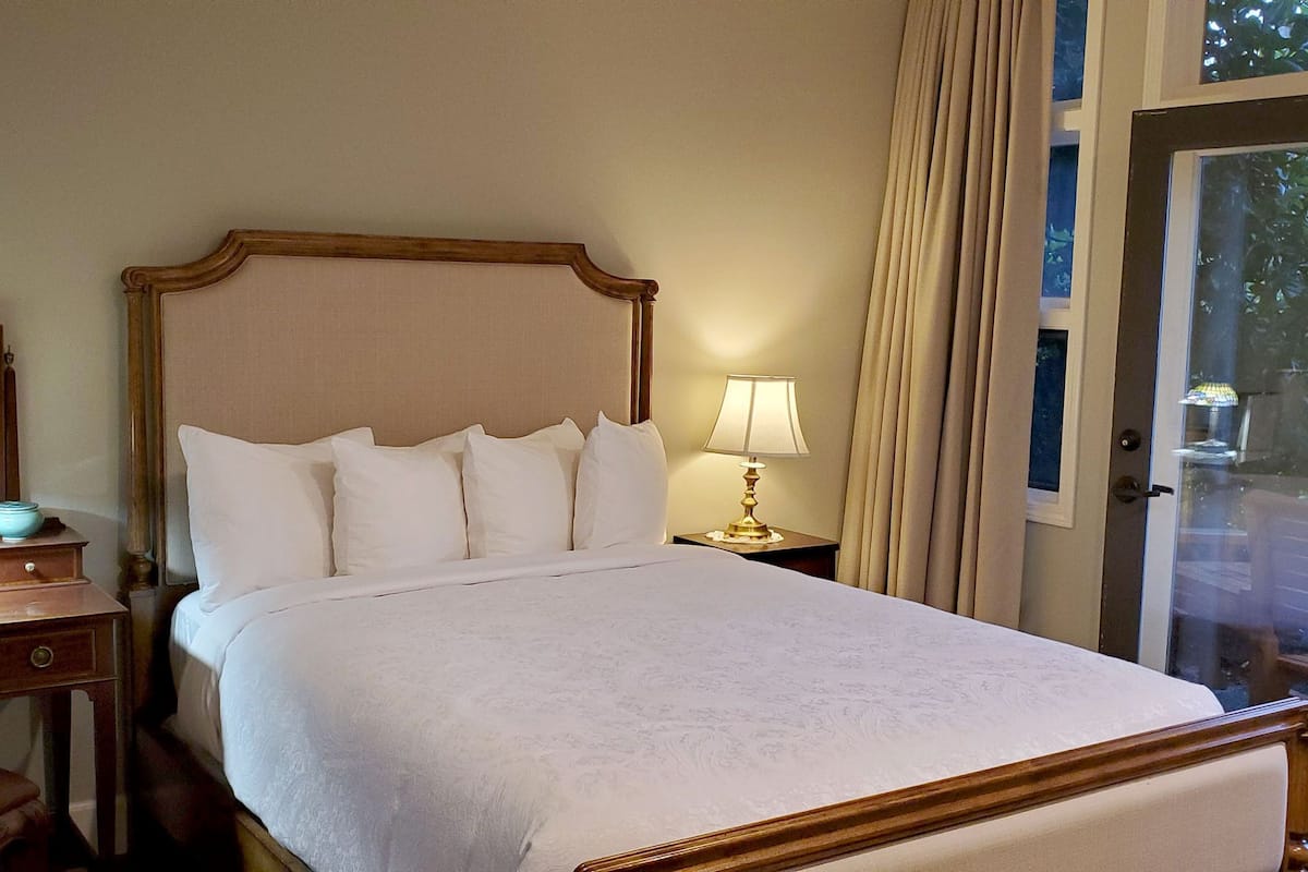 Queen Room with patio (#101) | Individually decorated, individually furnished, blackout drapes