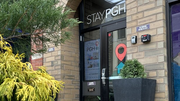 A brick building with a large arched entrance labeled "STAYPGH". - Stay Pittsburgh (Pittsburgh)