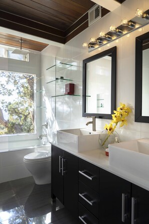 Bathtub, hair dryer, towels, soap
