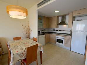 Microwave, dishwasher, toaster, dining tables