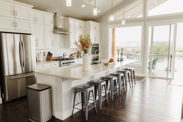 Fridge, microwave, oven, stovetop - Stunning Riverfront home- River access with Hot Tub & Game Room! (Marsing)