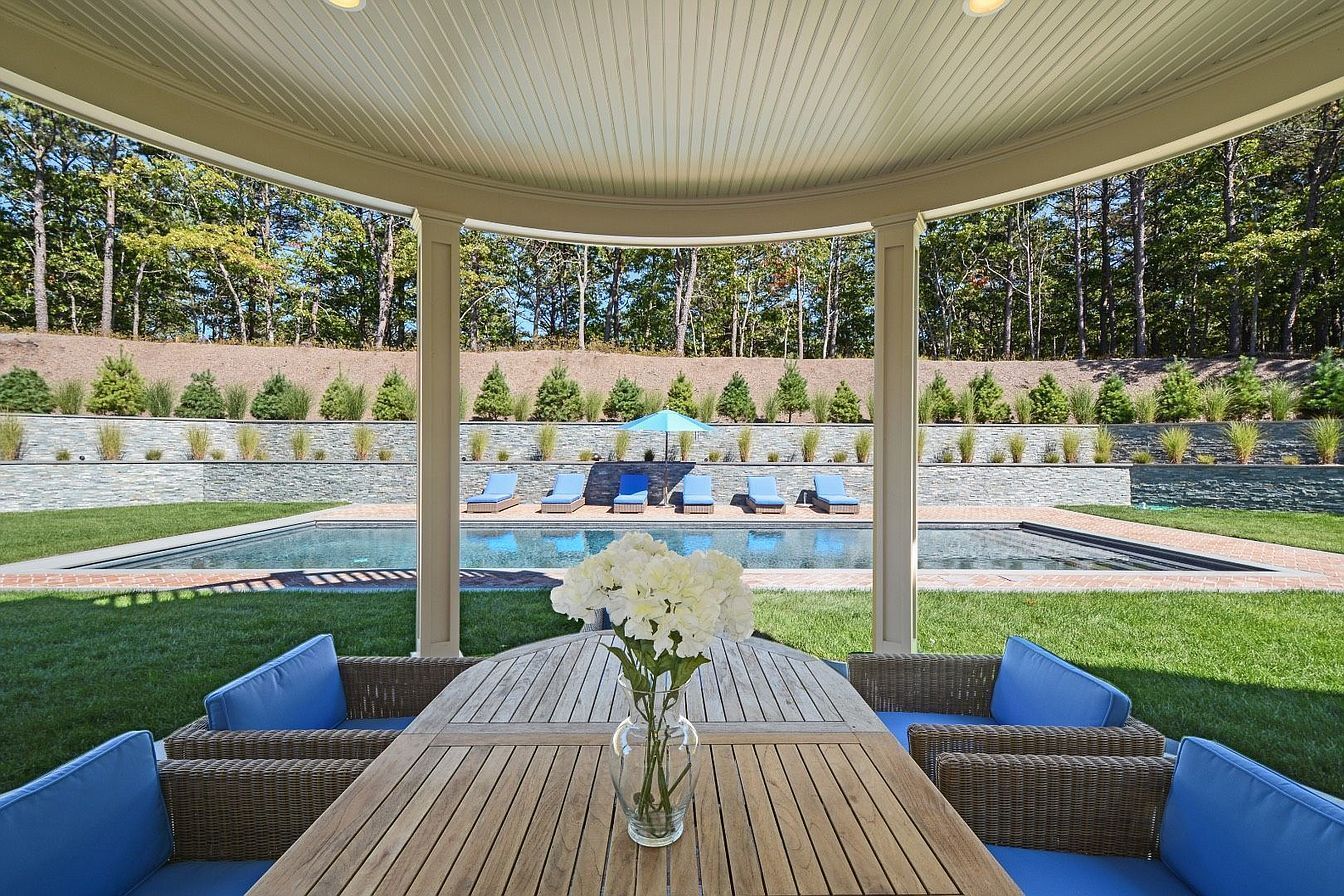 view from living room towards pool, outdoor dining