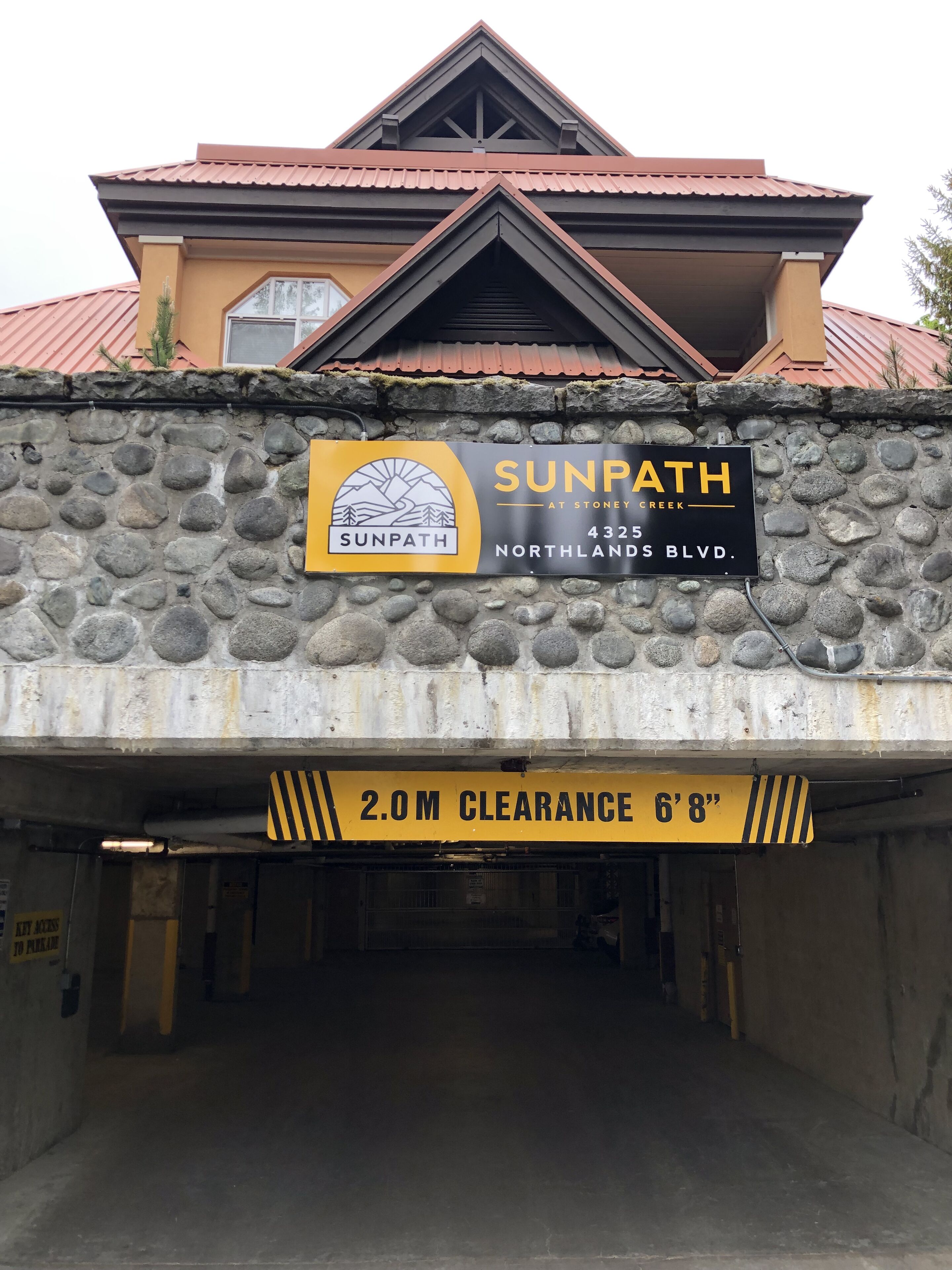 Parking entrance. Use visitor parking before gate to get key fob from unit.