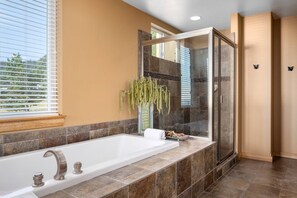 Bathtub, hair dryer, towels, shampoo