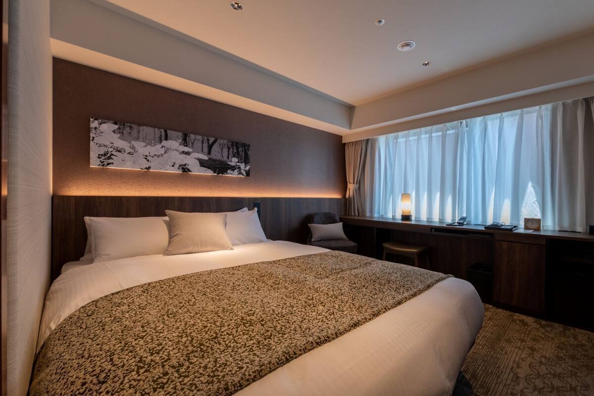 Down comforters, desk, blackout drapes, soundproofing