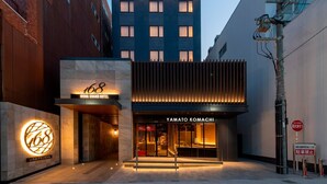 The exterior of the 168 IROHA GRAND HOTEL with a modern facade, a prominent entrance, and a visible sign for YAMATO KOMACHI. - IROHA GRAND HOTEL KINTETSUNARAEKIMAE (Nara)