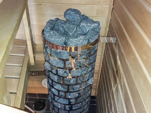 A cylindrical object with a brick-like pattern, possibly a decorative piece or a part of the room's architecture.