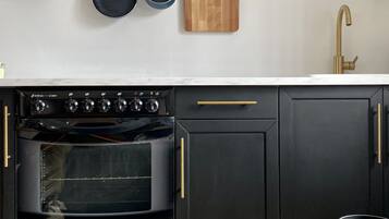 Fridge, oven, coffee/tea maker, cookware/dishes/utensils