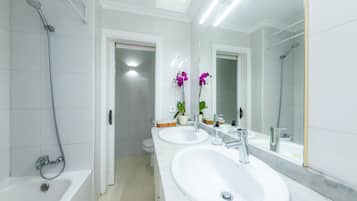 Bathtub, hair dryer, towels
