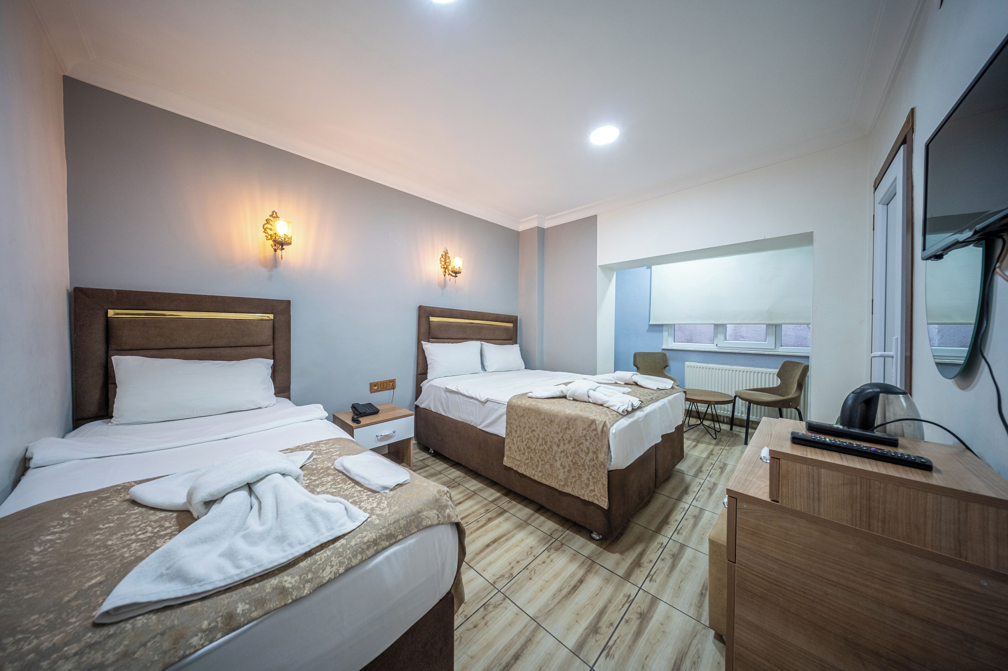 Economy driepersoonskamer | Luxe beddengoed, donsdekens, geluiddichte muren, gratis wifi