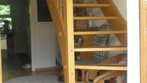 A wooden staircase with a handrail, leading to a lower level. - Gite Rural, restaurant without alcohol/pork (Beurnevésin)