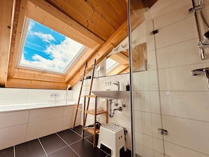 Bathtub, hair dryer, towels, soap