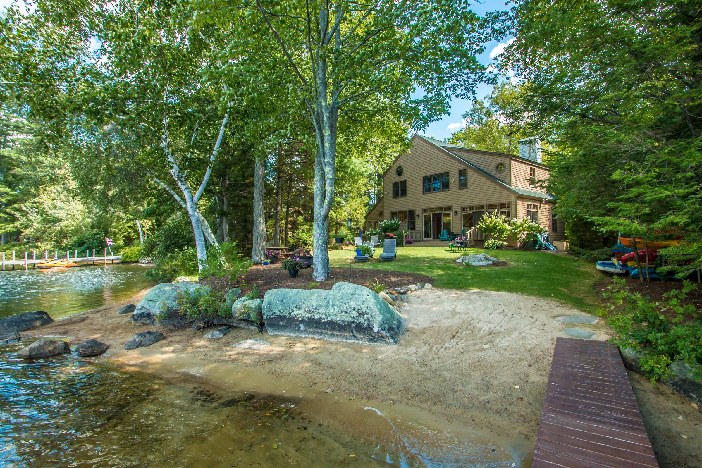 Waterfront home in Moultonborough with sandy beach and dock