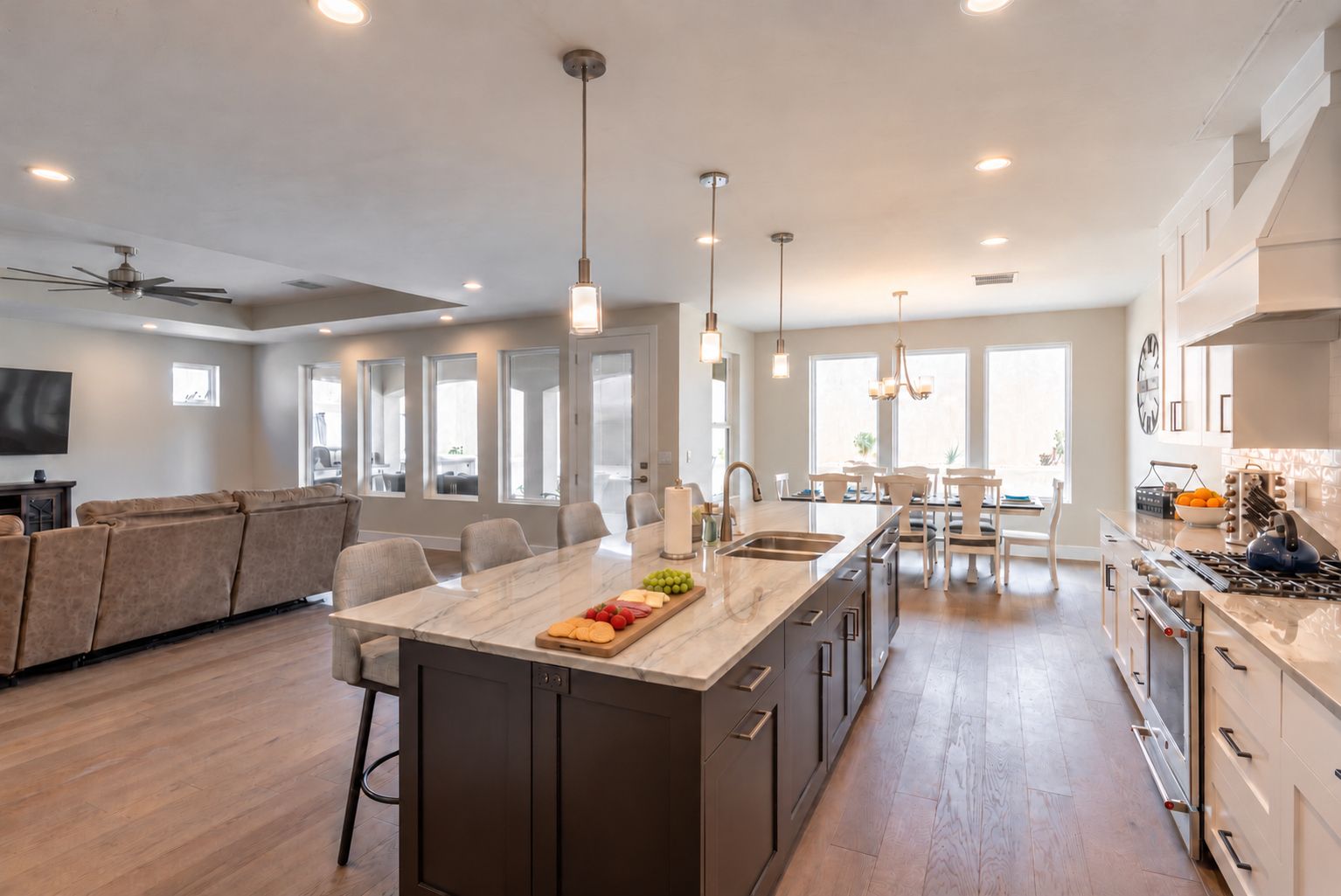 A spacious kitchen with a central island, modern appliances, and ample natural light.