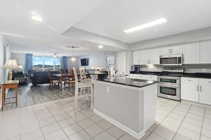 Enjoy meals in the spacious kitchen and dining area, featuring a large window with a view of the outdoors.