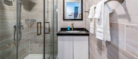 Shower, hair dryer, towels, soap