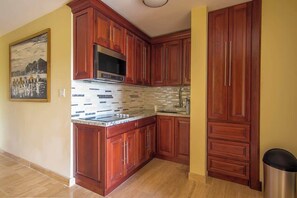 Fridge, microwave, coffee/tea maker, cookware/dishes/utensils