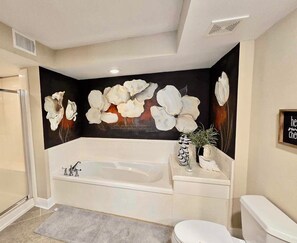 Combined shower/tub, hair dryer, towels, soap