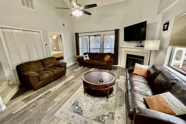 Family room with sleeper sofa and 55" smart TV