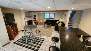 Smart TV, fireplace, DVD player, books