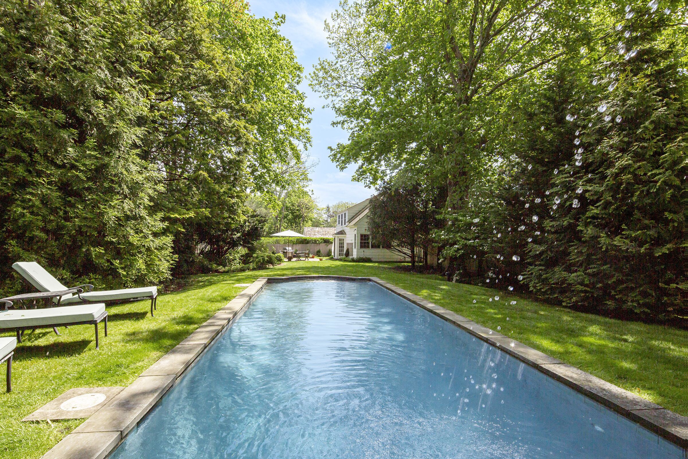 Classic Hamptons retreat; large yard and pool near town and the beach!