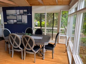 Enjoy dining al fresco in this serene outdoor space with a large table and comfortable seating for six.