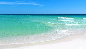 A beach with clear turquoise water and white sand. - Million-Dollar Gulf Views • Majestic Beach Resort 504 Tower 1• Beachfront • Pool (Panama City Beach)